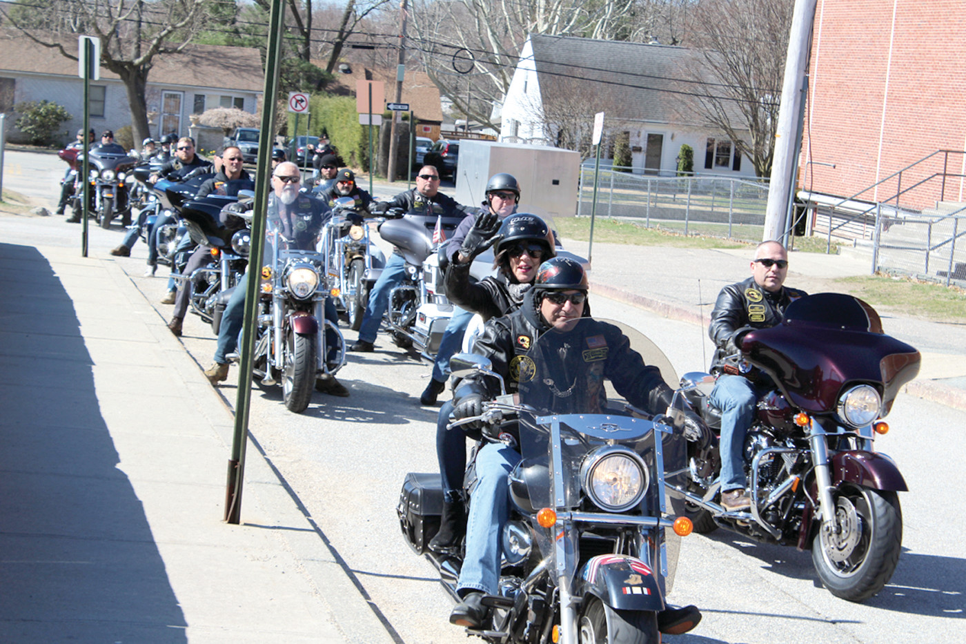 FIVE MINUTES: It took more than five minutes for all three hundred motorcyclists to leave the parking lot at Cranston West, many offering a wave or a peace sign on their way out.